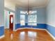 Spacious dining room with hardwood floors and chandelier at 1004 Flying M Ct, Edgewater, FL 32132