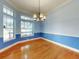 Bright dining room with hardwood floors and large window at 1004 Flying M Ct, Edgewater, FL 32132