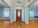 Bright entryway with hardwood floors and access to other rooms at 1004 Flying M Ct, Edgewater, FL 32132