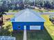 Blue metal roof garage with white door at 1004 Flying M Ct, Edgewater, FL 32132