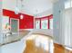 Kitchen with granite countertop and red accent wall at 1004 Flying M Ct, Edgewater, FL 32132