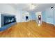 Spacious living room with hardwood floors and fireplace at 1004 Flying M Ct, Edgewater, FL 32132