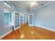 Spacious office with hardwood floors, french doors, and large windows at 1004 Flying M Ct, Edgewater, FL 32132