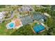 Aerial view of community tennis courts, pool, and clubhouse at 1104 Red Maple Way, New Smyrna Beach, FL 32168