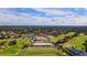 Expansive aerial view of golf course and clubhouse at 1104 Red Maple Way, New Smyrna Beach, FL 32168