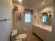 Well-lit bathroom with a large vanity and mirror at 1104 Red Maple Way, New Smyrna Beach, FL 32168