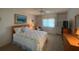 Guest bedroom with built-in shelving at 1104 Red Maple Way, New Smyrna Beach, FL 32168