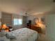 Guest bedroom with built-in shelving at 1104 Red Maple Way, New Smyrna Beach, FL 32168