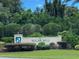 Welcoming entrance to Sugar Mill Country Club at 1104 Red Maple Way, New Smyrna Beach, FL 32168