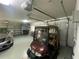 Garage features golf cart and storage at 1104 Red Maple Way, New Smyrna Beach, FL 32168