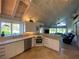 Modern kitchen with stainless steel appliances and view to living room at 1104 Red Maple Way, New Smyrna Beach, FL 32168