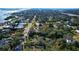 Wide aerial showcasing waterfront homes and community at 1116 Magnolia St, New Smyrna Beach, FL 32168