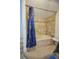 Simple bathroom with a shower/tub combo and tiled walls at 1116 Magnolia St, New Smyrna Beach, FL 32168