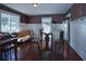 Charming dining room includes hardwood floors, glass-top table, and striped wallpaper at 1116 Magnolia St, New Smyrna Beach, FL 32168