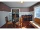 Small dining area with wood floors and glass-top table at 1116 Magnolia St, New Smyrna Beach, FL 32168