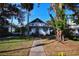 House exterior showcasing a large yard and walkway at 1116 Magnolia St, New Smyrna Beach, FL 32168