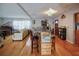 Open living room with hardwood floors and kitchen island at 1116 Magnolia St, New Smyrna Beach, FL 32168