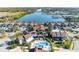 Aerial view of waterfront villas with pool and boat dock, showcasing community's waterfront access and amenities at 113 Lagoon Ct, New Smyrna Beach, FL 32169