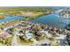 Aerial view of waterfront community with lush landscaping, pool, and convenient marina access at 113 Lagoon Ct, New Smyrna Beach, FL 32169
