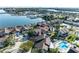 Aerial view of waterfront condos featuring a swimming pool and lush landscaping at 113 Lagoon Ct, New Smyrna Beach, FL 32169