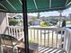 View from the balcony overlooking well-maintained landscaping and neighborhood at 113 Lagoon Ct, New Smyrna Beach, FL 32169