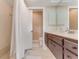 Bathroom featuring a shower and a wood-look vanity with a white countertop at 113 Lagoon Ct, New Smyrna Beach, FL 32169