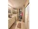 Modern bathroom with walk-in shower, sink with granite countertop and built-in storage at 113 Lagoon Ct, New Smyrna Beach, FL 32169