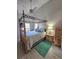 Bedroom featuring a four-poster bed, a ceiling fan, and hardwood floors at 113 Lagoon Ct, New Smyrna Beach, FL 32169