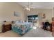 Bright bedroom featuring a ceiling fan, balcony access, and decorative accents at 113 Lagoon Ct, New Smyrna Beach, FL 32169