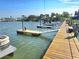 Modern boat dock featuring multiple slips, providing convenient waterfront access for boating and recreational activities at 113 Lagoon Ct, New Smyrna Beach, FL 32169