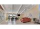 Bright clubhouse featuring high ceilings, comfortable seating, and a mounted TV for gatherings and relaxation at 113 Lagoon Ct, New Smyrna Beach, FL 32169