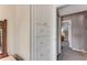 Hallway with a built-in wardrobe and view to a bedroom with a wooden dresser at 113 Lagoon Ct, New Smyrna Beach, FL 32169