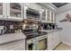 Well-equipped kitchen featuring stainless steel appliances, sleek countertops, and modern cabinetry for efficient cooking at 113 Lagoon Ct, New Smyrna Beach, FL 32169