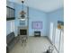 Bright living room with fireplace, high ceilings, large windows, and an airy feel at 113 Lagoon Ct, New Smyrna Beach, FL 32169