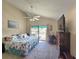 Spacious main bedroom with large TV and private balcony access at 113 Lagoon Ct, New Smyrna Beach, FL 32169