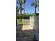 Private patio enclosed by a white fence, perfect for outdoor relaxation and entertaining at 113 Lagoon Ct, New Smyrna Beach, FL 32169
