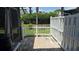 Enclosed patio space with brick pavers and a white picket fence offers privacy and charm at 113 Lagoon Ct, New Smyrna Beach, FL 32169