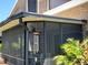 Enclosed patio with screened walls, plants, and outdoor seating perfect for relaxing and entertaining guests at 113 Lagoon Ct, New Smyrna Beach, FL 32169