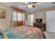 Bright bedroom with colorful bedding and ample closet space at 1339 N Fowler Dr, Deltona, FL 32725