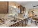 Kitchen with sink, granite countertop, and wood cabinets at 1339 N Fowler Dr, Deltona, FL 32725