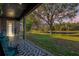 Spacious back patio with pond view and ample seating at 1409 Arbitus Cir, Oviedo, FL 32765