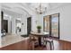 Elegant dining area with a round table and four metal chairs near entryway at 1409 Arbitus Cir, Oviedo, FL 32765