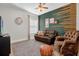 Cozy Gathering room with leather seating and accent wall at 1409 Arbitus Cir, Oviedo, FL 32765