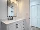 Bright bathroom with quartz countertop, modern fixtures, and a framed mirror at 1423 Palmetto St, New Smyrna Beach, FL 32168