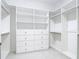 Walk-in closet with custom shelving and drawers, offering ample storage space at 1423 Palmetto St, New Smyrna Beach, FL 32168