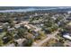 Aerial neighborhood shot of residential streets, mature trees, and diverse homes in a charming community at 1423 Palmetto St, New Smyrna Beach, FL 32168