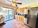 Kitchen boasts stainless steel appliances and pool access at 1424 Breaks Way, Port Orange, FL 32127