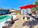 Enjoy this relaxing poolside patio area with table and umbrella at 1424 Breaks Way, Port Orange, FL 32127