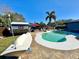 Large kidney shaped pool, patio furniture, and shed at 1424 Breaks Way, Port Orange, FL 32127