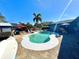 Inviting kidney-shaped pool with patio and palm tree at 1424 Breaks Way, Port Orange, FL 32127